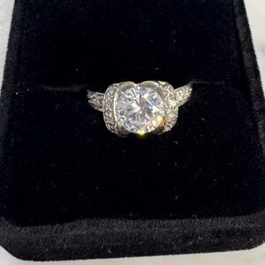 Sterling silver and cubic zirconia marked 925 MJI fashion ring. Size 7 1/2.